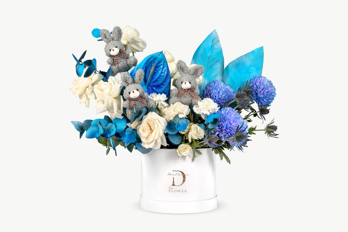 Delicate flower arrangement for newborn baby celebrations